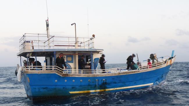 This boat carrying asylum-seekers from Sri Lanka was the third intercepted while trying to reach Australia since the federal election. The five men aboard were flown back to Colombo yesterday morning.