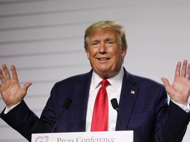 US President Donald Trump gestures during a joint-press conference with French President Emmanuel Macron in Biarritz, south-west France on August 26, 2019, on the third day of the annual G7 Summit attended by the leaders of the world's seven richest democracies, Britain, Canada, France, Germany, Italy, Japan and the United States. (Photo by Ludovic MARIN / AFP)