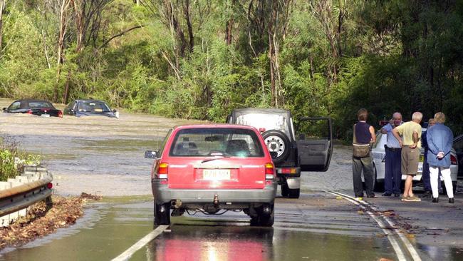 Two cars trapped by floodwaters on Wakehurst Parkway back in March, 2003. Picture: John Grainger.