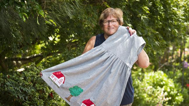 Maryann Bougoure with a dress she made for her daughter 30 years ago that she recently bought back after it was donated to Vinnies when she was working sorting donations, Monday, January 27, 2020. Picture: Kevin Farmer