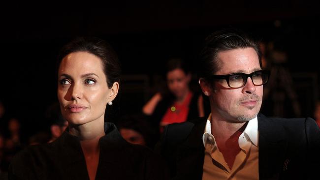 Angelina Jolie and her then husband Brad Pitt at a conference in London in 2014 on ending sexual violence in conflict. Picture: Carl Court/ AFP