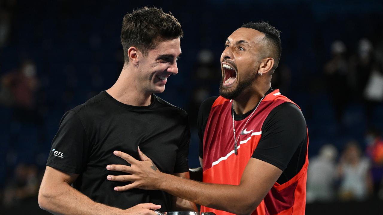 Thanasi Kokkinakis and Nick Kyrgios react after their victory.