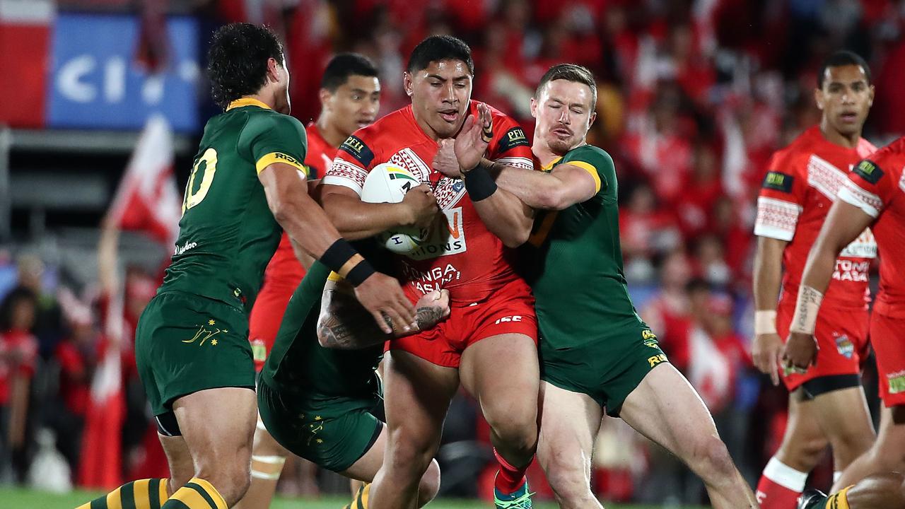 Jason Taumalolo of Tonga (C) is tackled by Australian players during the rugby league international Test match between Australia and Tonga 