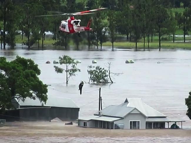 A screenshot taken from video posted by NSW RFS showing a helicopter evacuation in the Taree area.Picture: Twitter / @NSWRFS