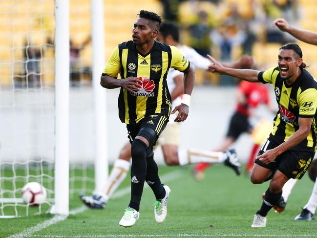 WELLINGTON, NEW ZEALAND - OCTOBER 21:  Roy Krishna of the Phoenix celebrates with David Williams after scoring a goal during the round one A-League match between the Wellington Phoenix and the Newcastle Jets at Westpac Stadium on October 21, 2018 in Wellington, New Zealand.  (Photo by Hagen Hopkins/Getty Images)