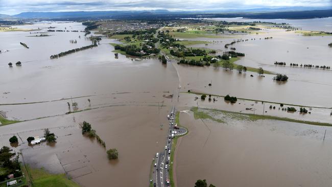 The flooded causeway at Maitland where a woman was in a car returning from grocery shopping was swept away. Picture: Adam Taylor