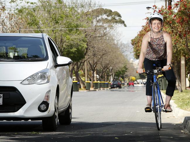 Cyclist Nicola Thompson in Croydon, riding alongside a car that’s one metre away. Picture: Bianca De Marchi