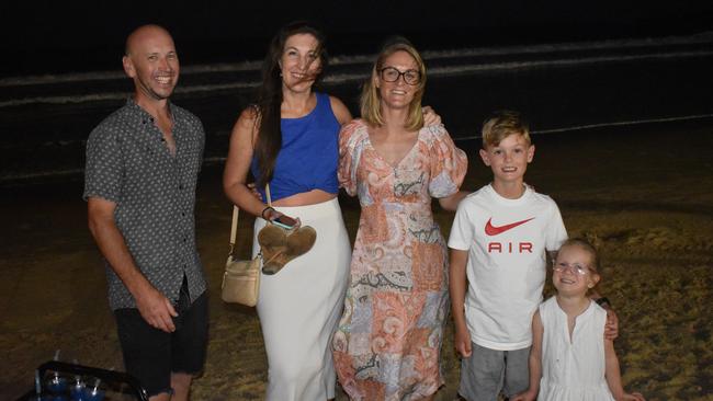 Shenae, Jono, Archer, Sage and Nichola (no surnames given) celebrating New Year's Eve 2022 at Mooloolaba. Photo: Elizabeth Neil