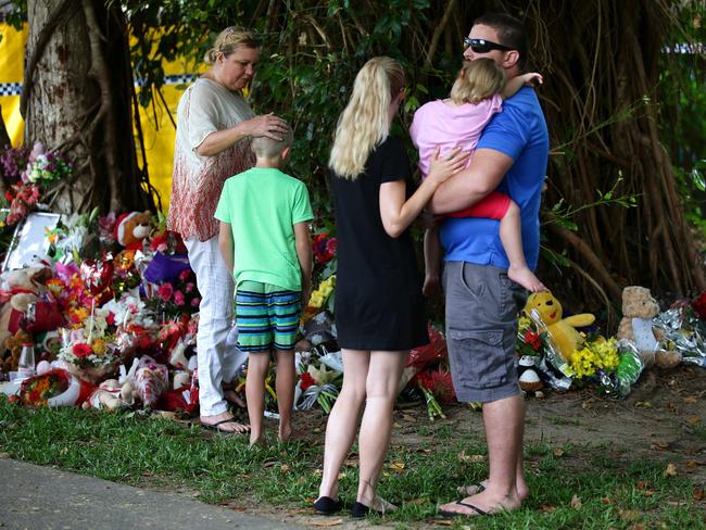 Families comforted each other near the house of horror.