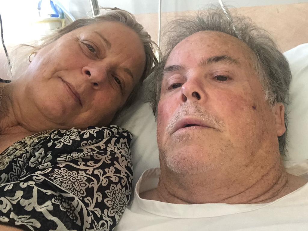 Steve Morris in hospital with his wife Stacey.