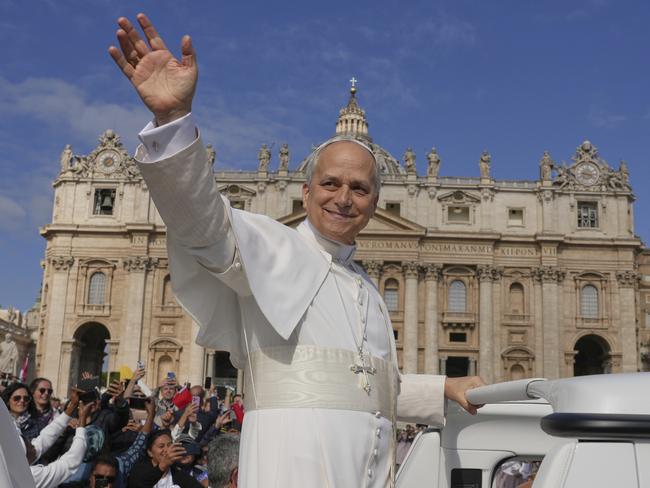 Pope Leo XIV on his popemobile tours St. Peter's Square at the Vatican prior to the inaugural Mass of his pontificate, Sunday, May 18, 2025. (AP Photo/Andrew Medichini)