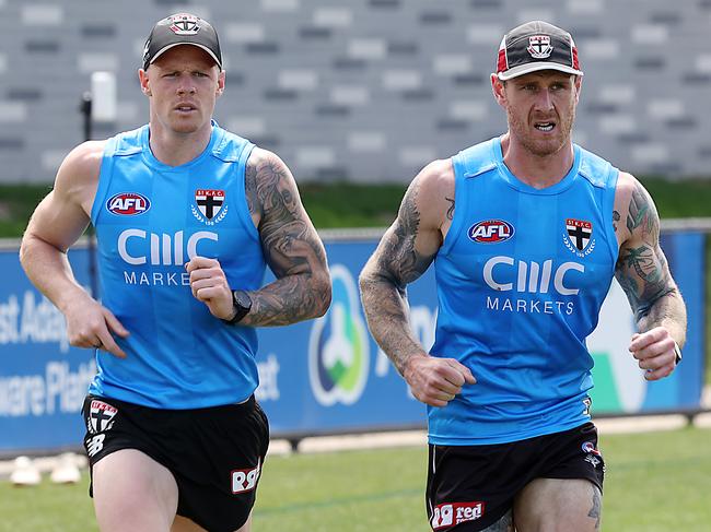 AFL. St Kilda training in hot conditions at Moorabbin. Zak Jones and Tim Membrey run laps. Picture: Ian Currie