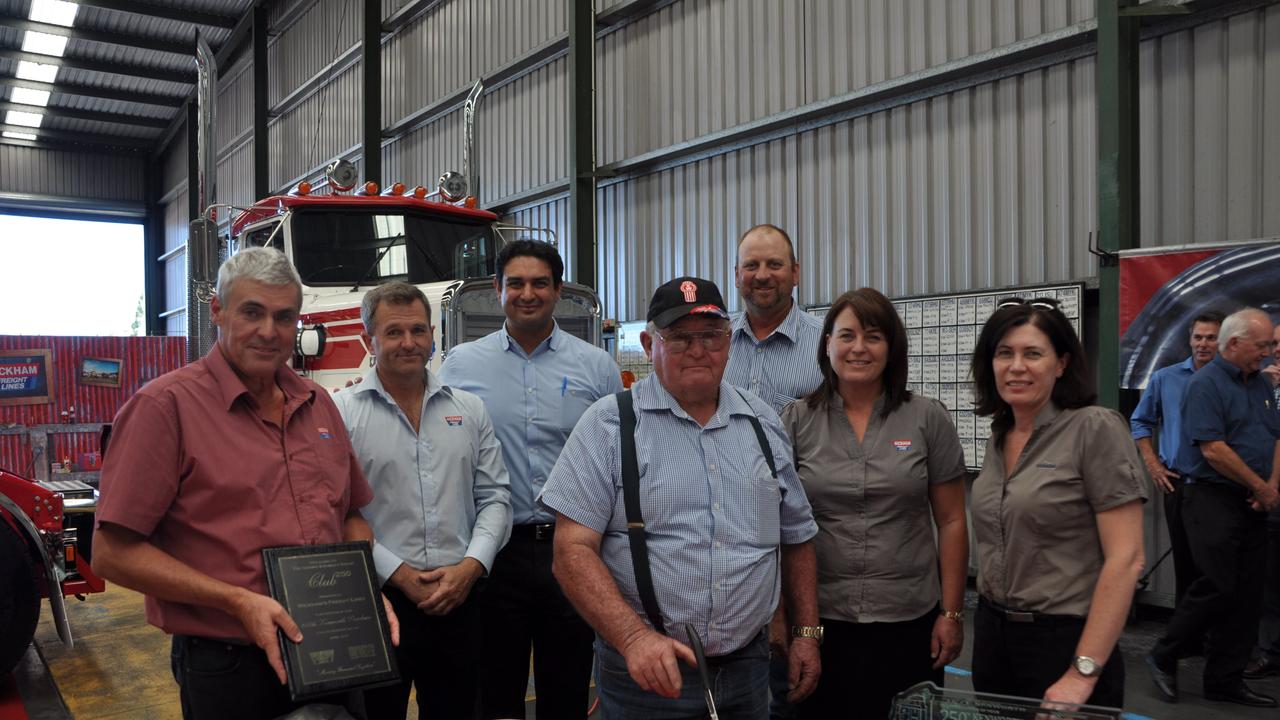 WICKHAMS MILESTONE: Celebrating the 250th Kenworth are (from left) Graham Keogh, Darren Eather, Andrew Hadjikakov, Peter Wickham, Haydn Lamb, Donna Keogh and Kerri- Ann Lamb.