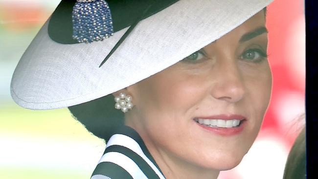 LONDON, ENGLAND - JUNE 15: Catherine, Princess of Wales smiles as she travels by carriage during Trooping the Colour at Buckingham Palace on June 15, 2024 in London, England. Trooping the Colour is a ceremonial parade celebrating the official birthday of the British Monarch. The event features over 1,400 soldiers and officers, accompanied by 200 horses. More than 400 musicians from ten different bands and Corps of Drums march and perform in perfect harmony. (Photo by Chris Jackson/Getty Images)