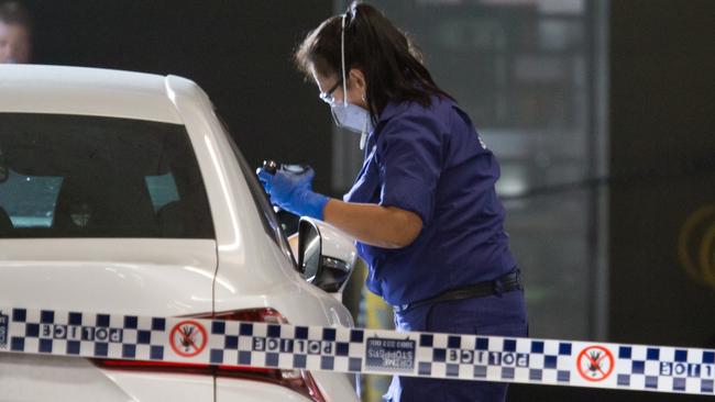 Forensics officers worked through the night after the shooting. Picture: Damian Hofman