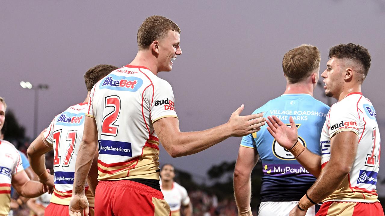 Jack Bostock of the Dolphins celebrates after scoring a try during the NRL Pre-season challenge match between the Dolphins and Gold Coast Titans.