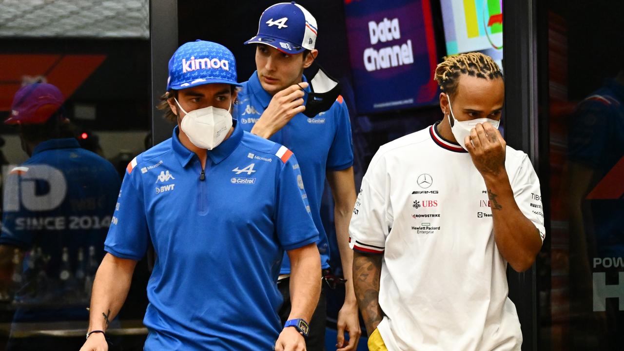 Lewis Hamilton of Great Britain and Mercedes, Fernando Alonso of Spain and Alpine F1 and Esteban Ocon of France and Alpine F1.