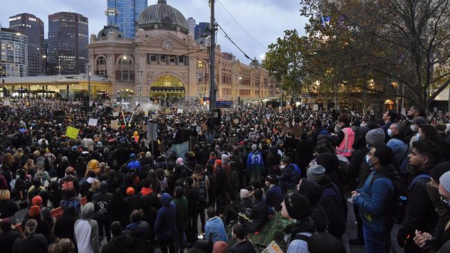 A huge crowd listens to speeches near Federation Square. Picture: Jason Edwards