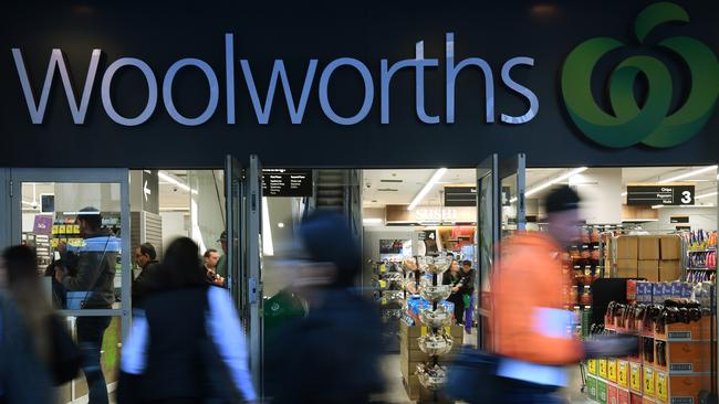 Shoppers walk past a Woolworths store in Sydney, Monday, August 20, 2018. Woolworths Group will hand down it's full year results today. (AAP Image/Dean Lewins) NO ARCHIVING