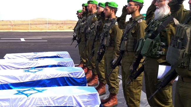 Israeli soldiers carry the coffins of deceased hostages. Picture: Government Press Office / GPO