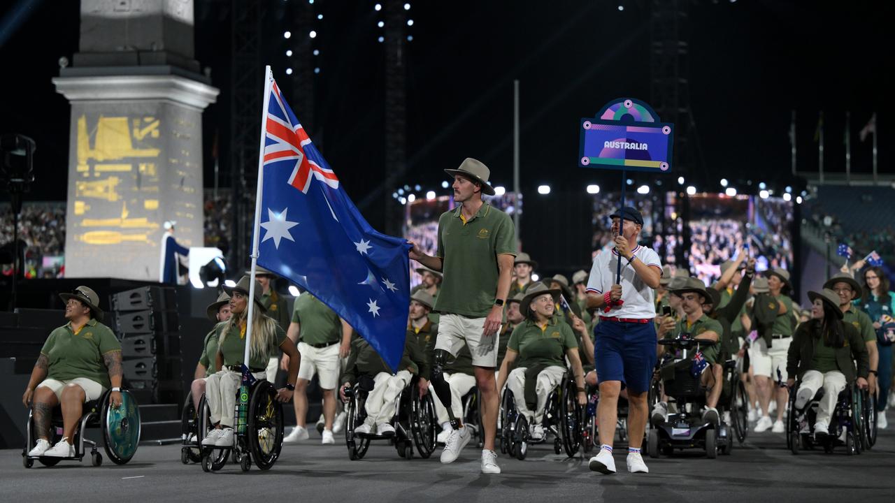 Madison De Rozario and Brenden Hall, Flag Bearers of Team Australia, hold their national flag as they parade during the opening ceremony of the Paris 2024 Summer Paralympic Games. Picture: David Ramos/Getty Images.