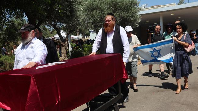 Relatives of an Israeli man killed in a Yemeni Houthi rebel drone attack on Tel Aviv follow undertakers to a cemetery in Rishon LeZion on Sunday. Picture: AFP