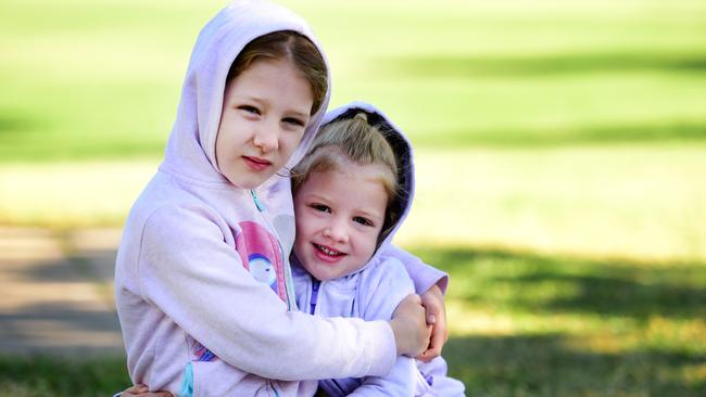 Weather; Annabel 6 and Zoe Graham 4 rugged up on the Strand.