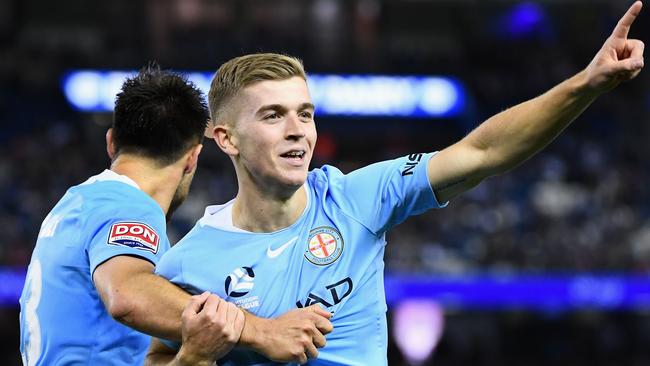 Riley McGree of Melbourne City celebrates scoring a goal against Melbourne Victory.