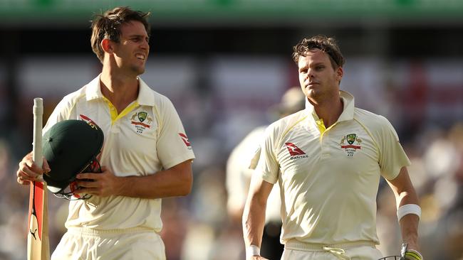 Steve Smith and Mitch Marsh of Australia leave the ground at stumps on day three.