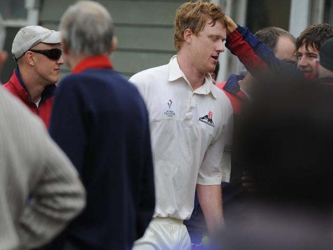 s40os970 - Premier cricket final - Frankston vs. Dandenong at Melbourne University. Butterfield from Dandenong is congratulated on the way back to the rooms.