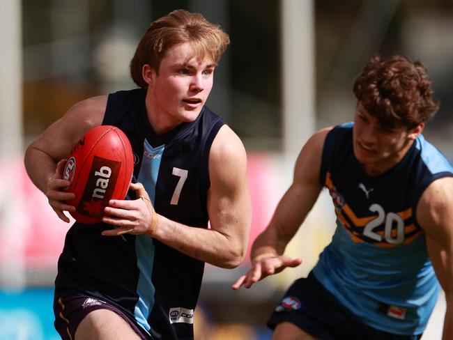 MELBOURNE, AUSTRALIA - AUGUST 13:Tom Gross of Vic Metro runs with the ball during the AFL U17 Futures Boys match between Vic Metro and NSW/ACT at Avalon Airport Oval on August 13, 2023 in Melbourne, Australia. (Photo by Kelly Defina/AFL Photos/via Getty Images)