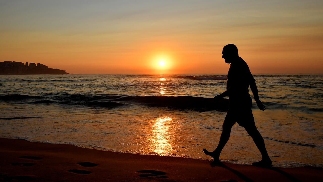 The sun rises through a smoke haze over Bondi Beach in Sydney, Tuesday, November 12. Picture: Joel Carrett/AAP