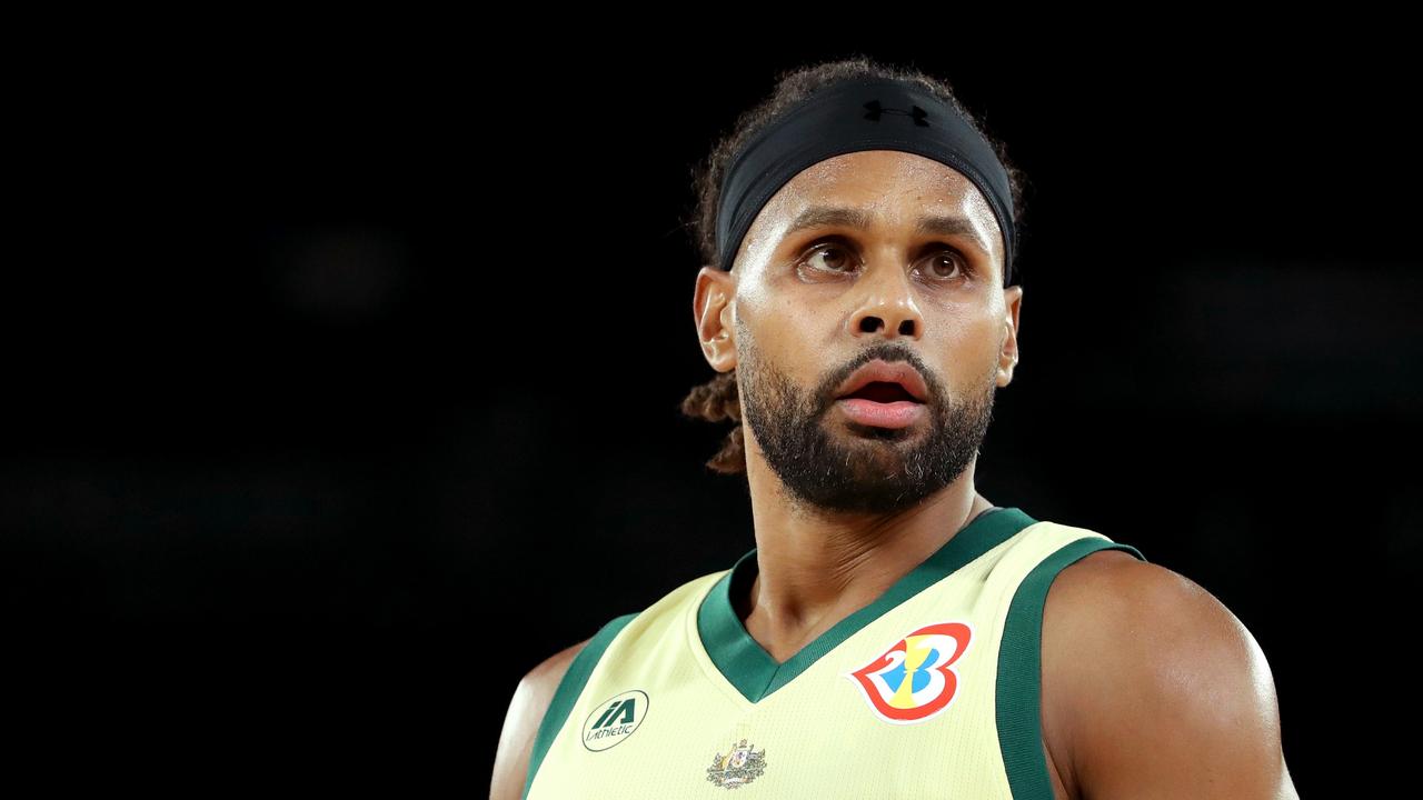 Patty Mills of Australia looks on. (Photo by Kelly Defina/Getty Images)