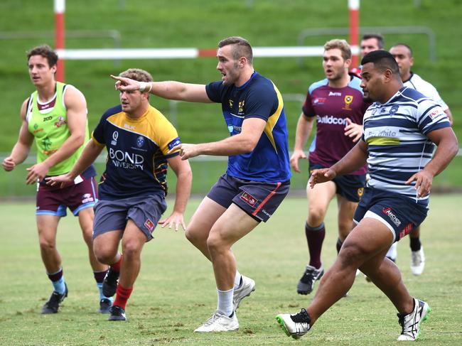 Izack Rodda (centre) during the Queensland Reds training session at Ballymore in Brisbane Monday, April 23, 2018. The Reds prepare to play South African team the Lions on Saturday. (AAP Image/Dave Hunt) NO ARCHIVING