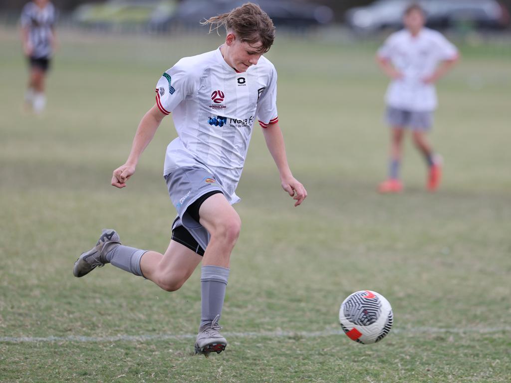 Premier Invitational Football 2024 tournament at Glennon Park Nerang. Field 5...Willowburn (black stripes) V Caboolture. Picture Glenn Hampson