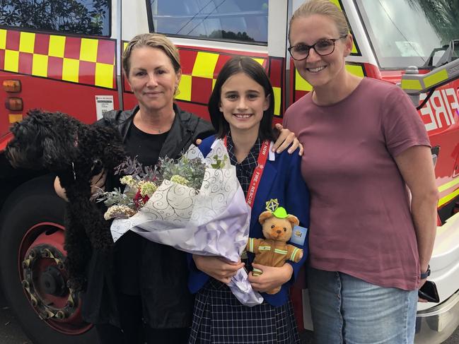 Samantha 'Sammy' Collins, 11, with her friend Neve's mum Kelly Evans (left) and her own mum, Katie Collins (right). Picture: Jim O'Rourke