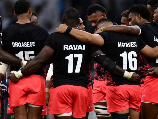 Fiji's players huddle after losing the France 2023 Rugby World Cup quarter-final match between England and Fiji at the Velodrome Stadium in Marseille, southeastern France, on October 15, 2023. (Photo by CHRISTOPHE SIMON / AFP)