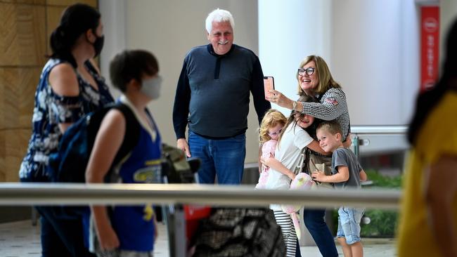 Greg and Jill Siddle welcome their grandchildren Holly, 5, Chloe, 7, and Max Cooper, 4, from New Zealand at Sydney International Airport. Picture: Bianca De Marchi