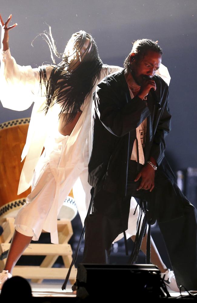 Kendrick Lamar, right, performs at the 60th annual Grammy Awards. Picture: AP