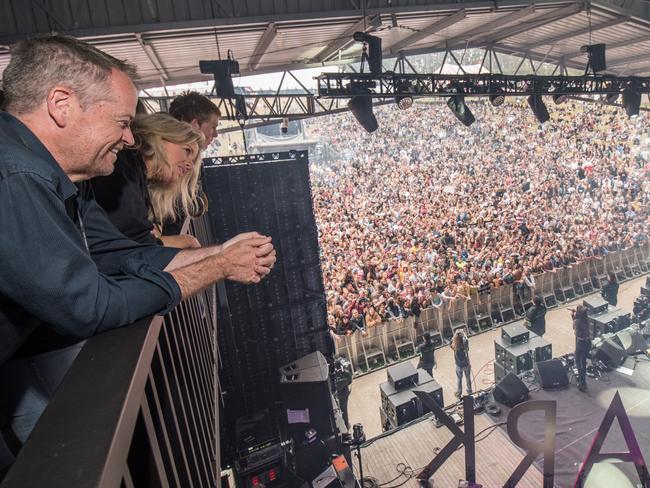 Bird’s eye view: Bill Shorten and his wife Chloe have a great view of the stage at the Falls Festival.