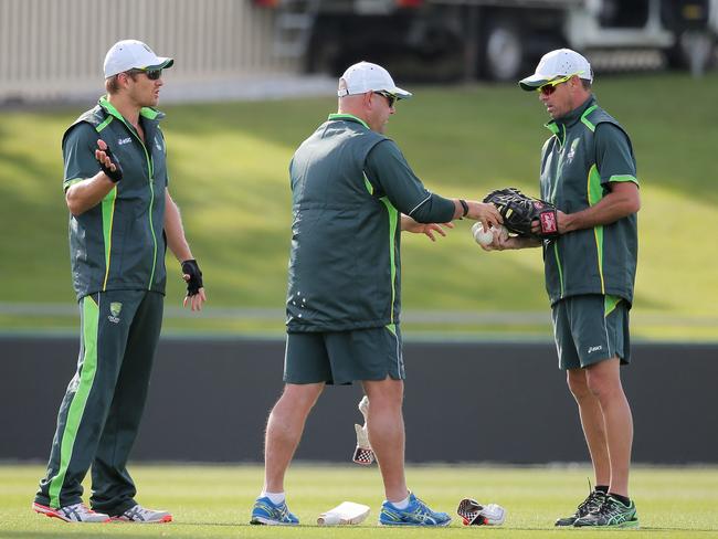 Greg Blewett works with Darren Lehmann and Shane Watson at training.