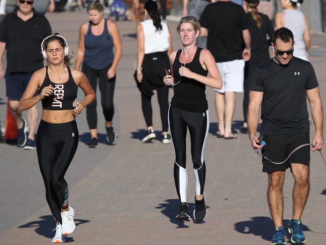 People at Bondi this morning seem to be observing good social-distancing while on their morning walks, compared to the crowds of people seen in previous weeks. Picture: David Swift.