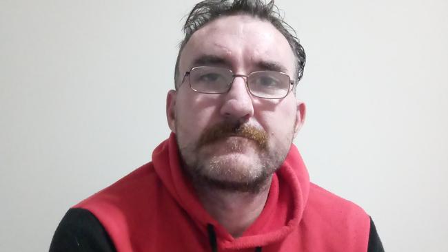 Violent parolee accused of stealing spits in Woolworths’ employee’s eye