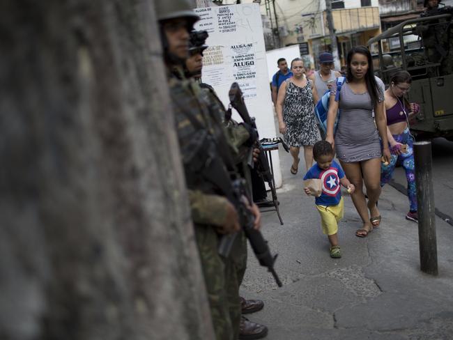 Rio de Janeiro is the second riskiest spot for Australian business travellers, who may unknowingly wander into dangerous favelas, where a number of foreigners have been killed in 2017. Picture: AP/Silvia Izquierdo