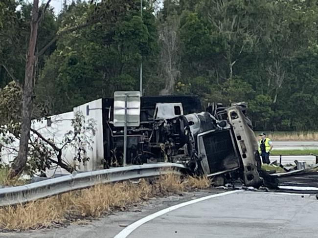 A truck rolled onto its side and caught fire on the M1 near Brunswick Heads about 6am on March 24, 2023. Picture: Savannah Pocock