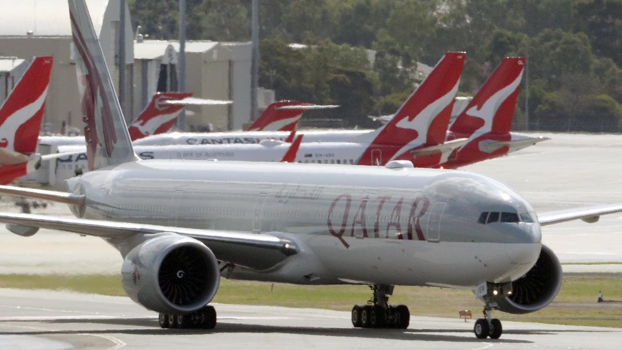 A Qatar Airways flight at Perth international airport among a sea of parked Qantas aircraft in March 2020. Picture: AAP