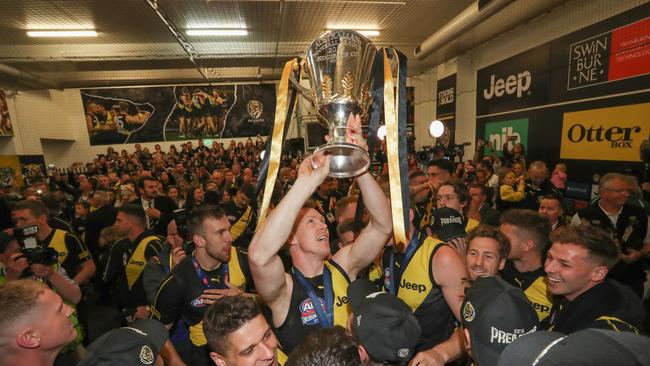 Jack Riewoldt hoists the cup aloft on the Richmond rooms. Picture: Alex Coppel