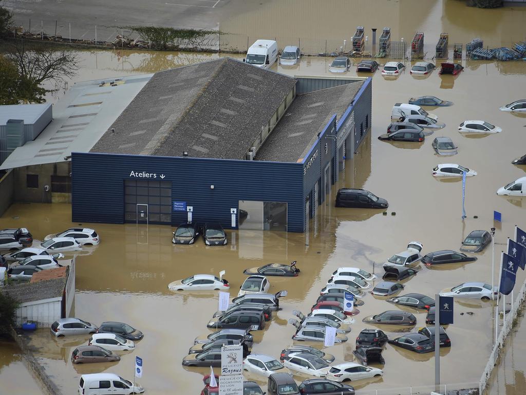 An aerial view shows a flooded Peugeot car maker garage in the city of Villegailhenc, near Carcassonne, southern France. Picture: AFP