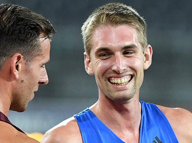 Cedric Dubler (centre) smiles after winning the Mens Decathlon at the Australian Athletics Championships competition on the Gold Coast, Saturday, February 17, 2018. (AAP Image/Dave Hunt) NO ARCHIVING