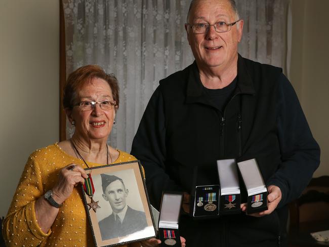 Deirdre English with Craigieburn War Memorial and Remembrance Committee president Kevin O'Callaghan and the unclaimed medals. Picture: George Salpigtidis